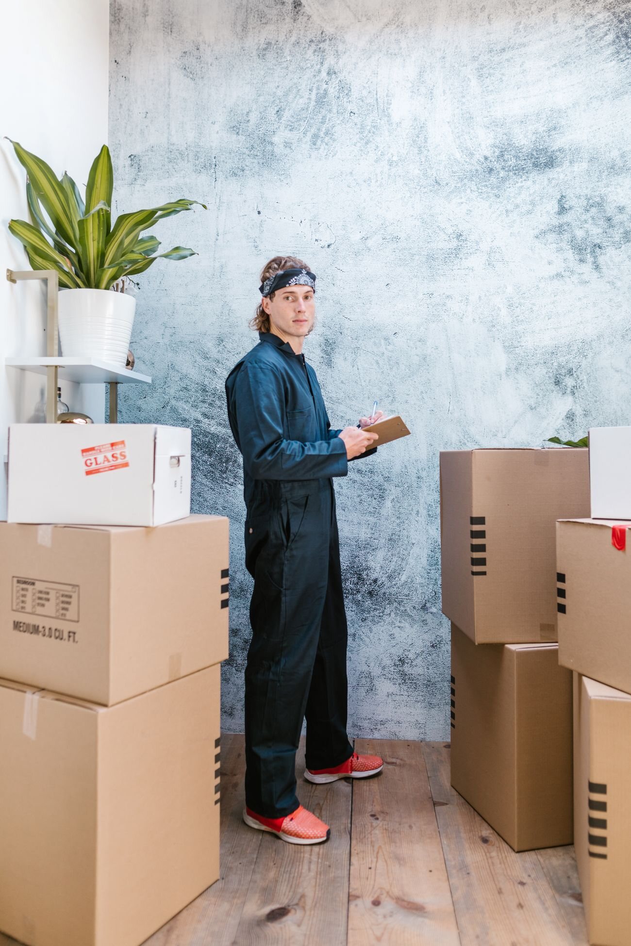 A uniformed A&T Moving and Hauling mover handling wrapped items on the job in Rockland County